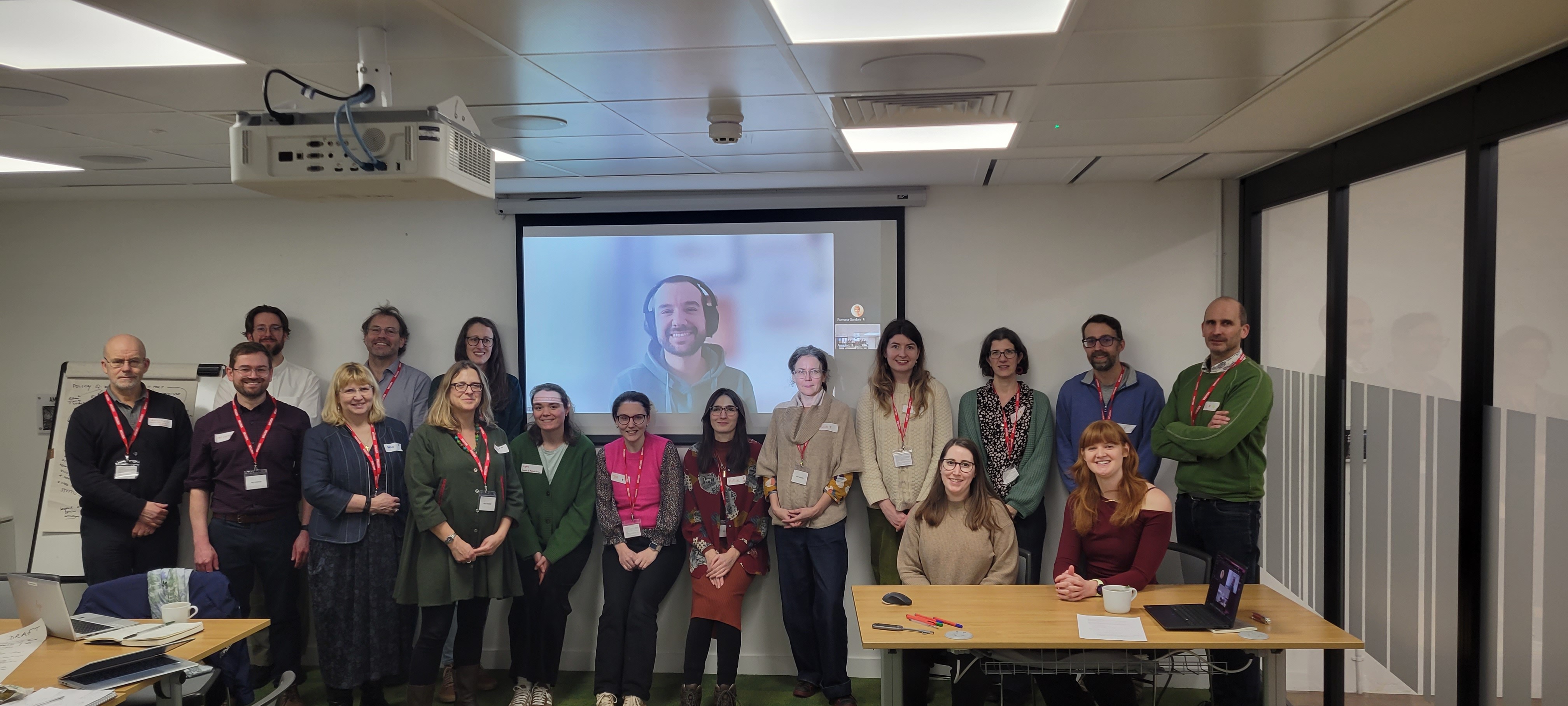 People standing in front of a presentation