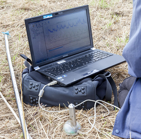 Laptop being used in a field